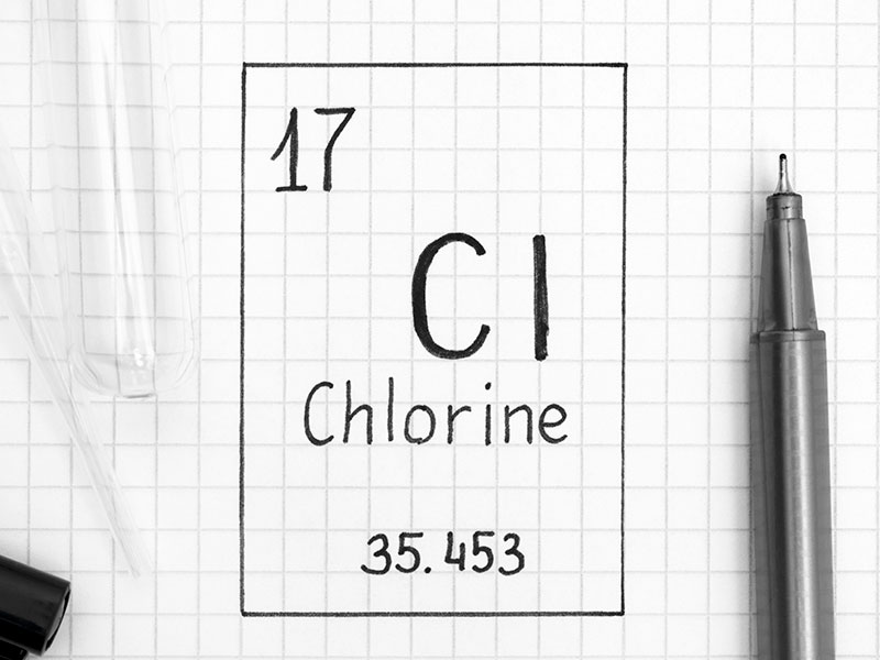 The Periodic table of elements. Handwriting chemical element Chlorine Cl with black pen, test tube